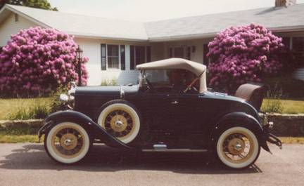 Russell and his Model A heading to the Memorial Day  Parade in 2002